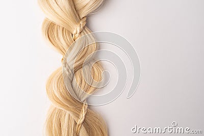 Human blond tress hair on isolated background Stock Photo