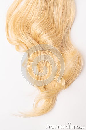 Human blond wavy hair on isolated background Stock Photo