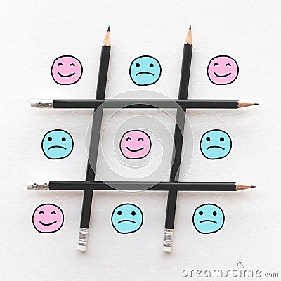 Human emotion concepts with emoticon face happy and sad in game line pattern Stock Photo