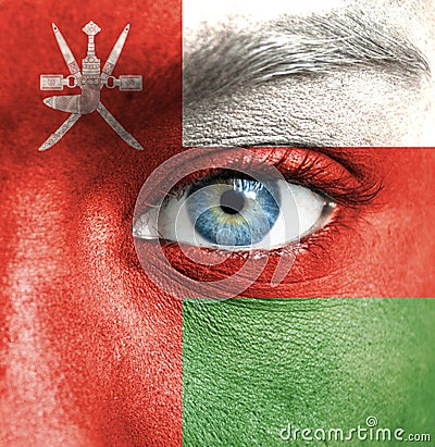 Human face painted with flag of Oman Stock Photo