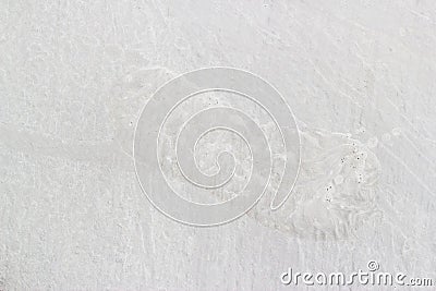 Human footprint on white cement floor Stock Photo