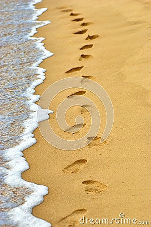 Human footprints on sand at the beach Stock Photo