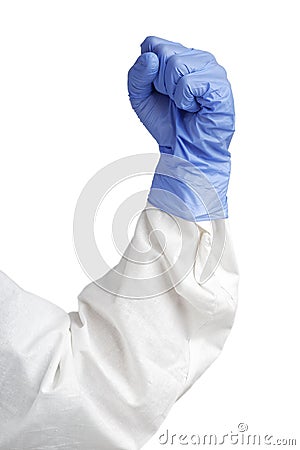 A human hand clench fist in a blue medical glove. Stock Photo