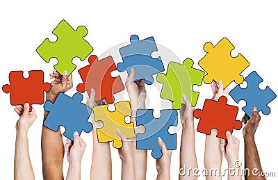 Human Hand Holding Colourful Jigsaw Puzzle Pieces Stock Photo