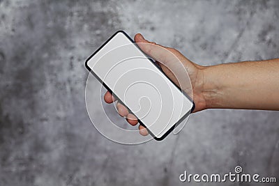 Human hand holding a lighted cell phone Stock Photo