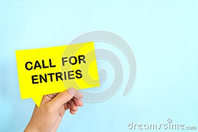Human hand holding speech bubble with written phrase Call for Entries. Join contest invitation. Stock Photo