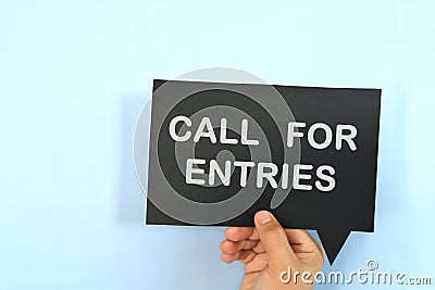 Human hand holding speech bubble with written phrase Call for Entries. Join contest invitation. Stock Photo