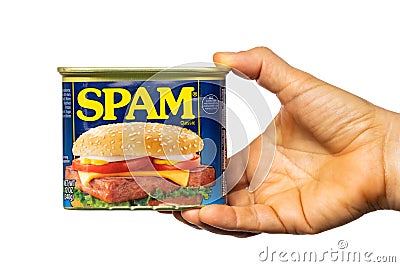 Human hand holding a tin can of SPAM canned meat Editorial Stock Photo