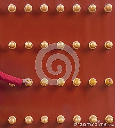 Human hand holding traditional Chinese door Stock Photo