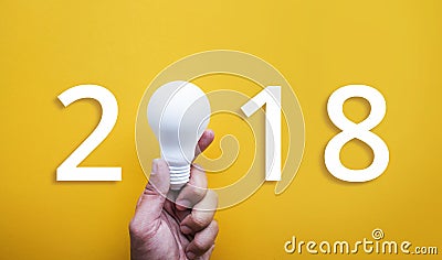 2018 Ideas creativity concept with human hand holding light bulb Stock Photo