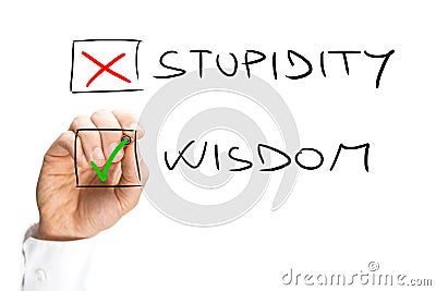 Human Hand Marking X on Stupidity and Check on Wisdom Stock Photo