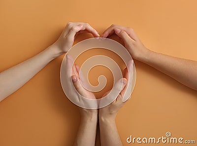 Human hands making heart on color background. Polyamory concept Stock Photo