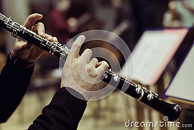 Human hands playing the oboe Stock Photo