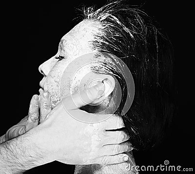 Human hands working with woman with clay Stock Photo