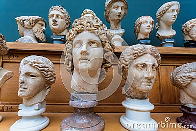 Human heads, marble copies of old Roman emperors and gods. Ancient history concept Stock Photo