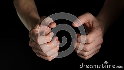 Human male palm clench a fist isolated on black background. Close up. Stock Photo