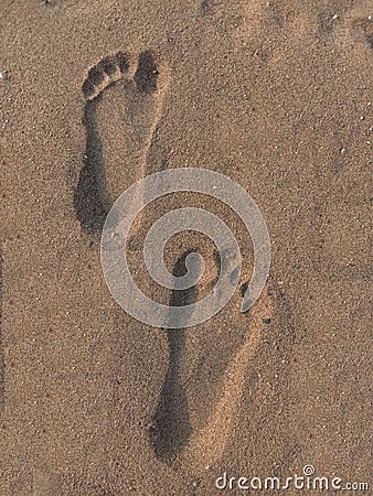 Human natural foot print on sand Stock Photo