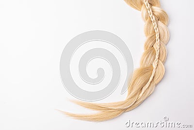 Human blond tress hair on isolated background Stock Photo
