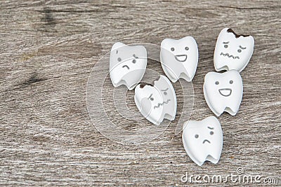 Human oral health concept - cute healthy and crying decayed teeth Stock Photo