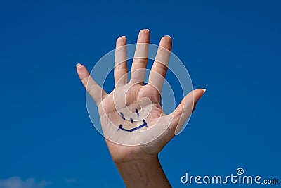 Human palm with smile Stock Photo