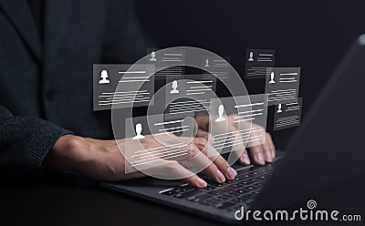 Human resource manager using computer laptop looking at many different cv resume and choosing perfect person to hire. HR concept Stock Photo
