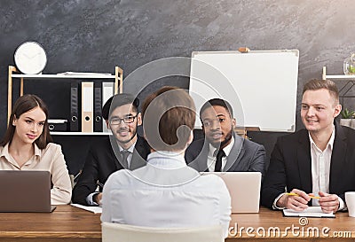 Human resources commission interviewing woman Stock Photo