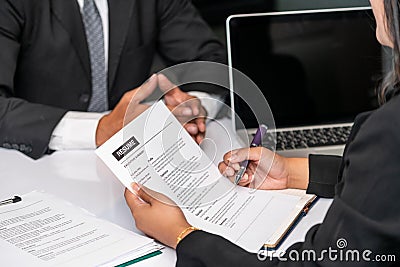 Human resources department manager reads CV resume Stock Photo