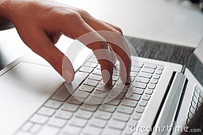 Human`s hand typing on the computer keyboard Stock Photo