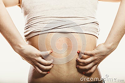 Human scratching itchy back skin. Rash. Stock Photo