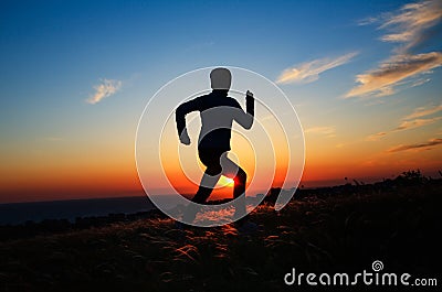 Human silhouette against sunset Stock Photo