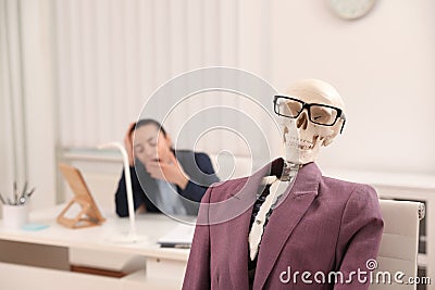 Human skeleton with suit and glasses. Space for text Stock Photo