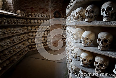 Human skulls inside a catacomb inside a catacomb Stock Photo