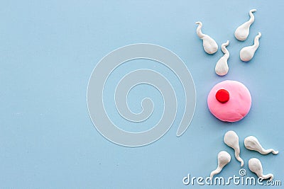 Human sperms impregnate fertile female egg ovum concept Stock Photo