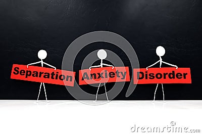 Human stick figure holding red Separation Anxiety Disorder word banner. Black background. Stock Photo