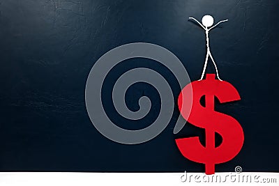 Human stick figure on top of a red dollar sign cutout. Financial success concept. Stock Photo