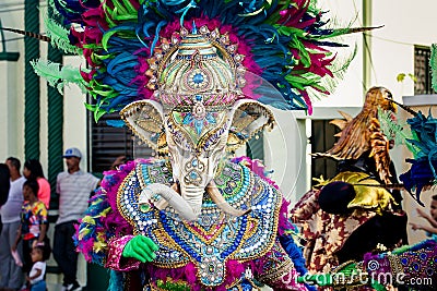 Human in vivid elephant costume poses for photo on city street at dominican carnival Editorial Stock Photo