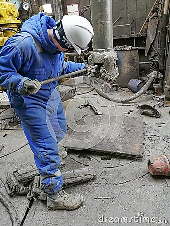 Human work while drilling an oil and gas well. Editorial Stock Photo