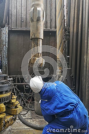 Human work while drilling an oil and gas well. Editorial Stock Photo