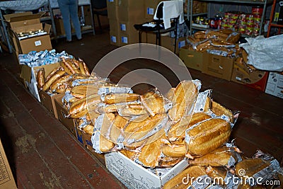 Humanitarian aid warehouse in ukrainian volunteer centre, boxes with bread Editorial Stock Photo