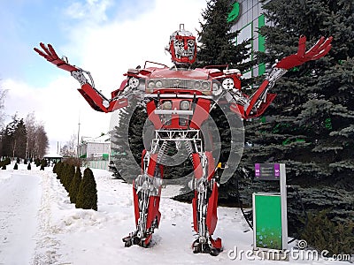 The humanoid metal funny robot the autoboat Red, is made of car spare parts, refuels gasoline, parts of body of the robot, Editorial Stock Photo