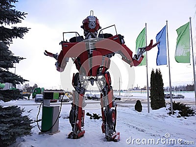 The humanoid metal funny robot the autoboat Red, is made of car spare parts, refuels gasoline, parts of body of the robot, Editorial Stock Photo