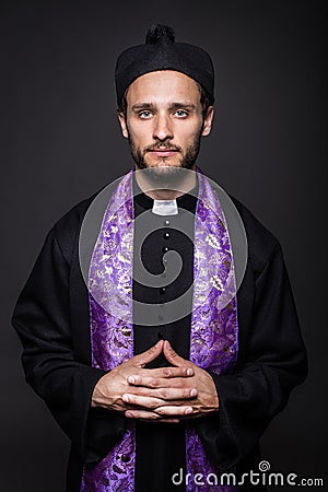 Humble catholic priest Stock Photo