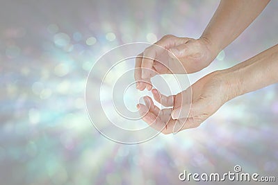Humble Healing Energy radiating from cupped hands Stock Photo