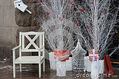 Santa chair near white trees and boxes with presents Stock Photo