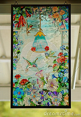 HUMMINGBIRDS STAINED GLASS HANGING Stock Photo