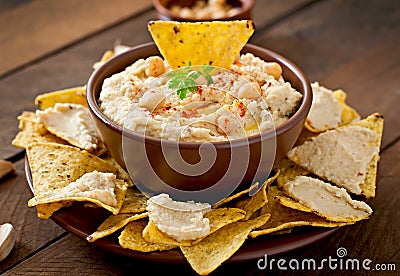 Hummus with olive oil and pita chips Stock Photo