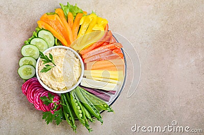 Hummus platter with assorted vegetable snacks. Healthy vegan and vegetarian food. Stock Photo