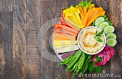 Hummus platter with assorted vegetable snacks. Healthy vegan and vegetarian food. Stock Photo