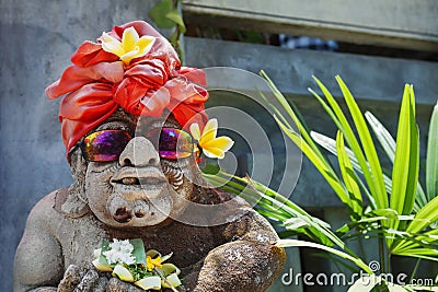 Humorous face portrait of old traditional Balinese temple guard Stock Photo