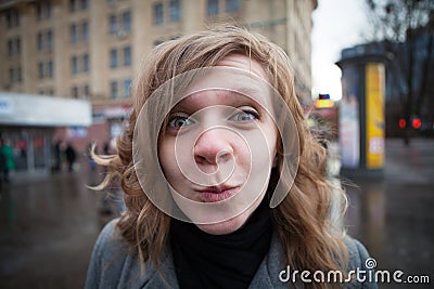 Humorous portrait of a young blond woman Stock Photo